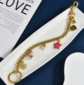 Gold Tone Purse Charm Chain with Snowflake, Pink Bunny and Floral Charms
