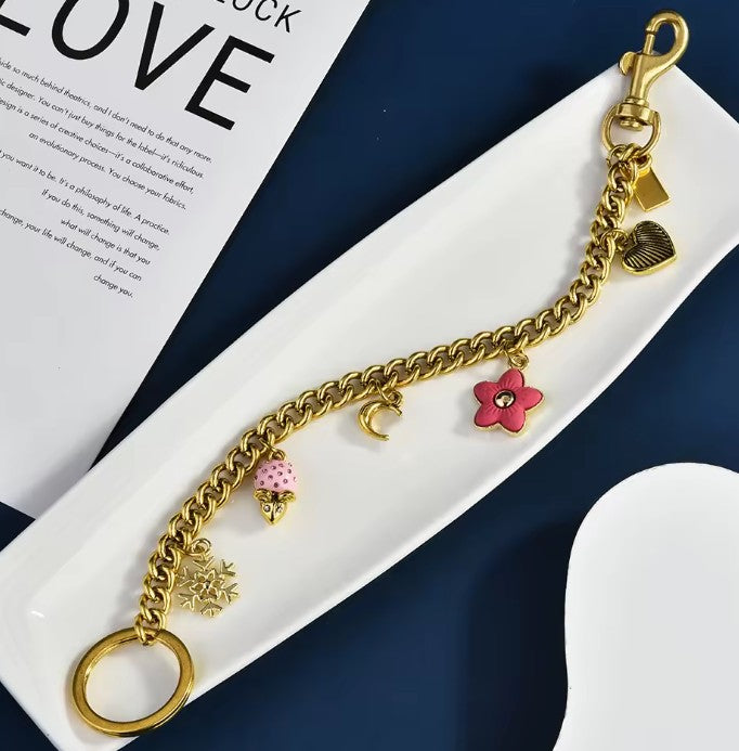 Gold Tone Purse Charm Chain with Snowflake, Pink Bunny and Floral Charms